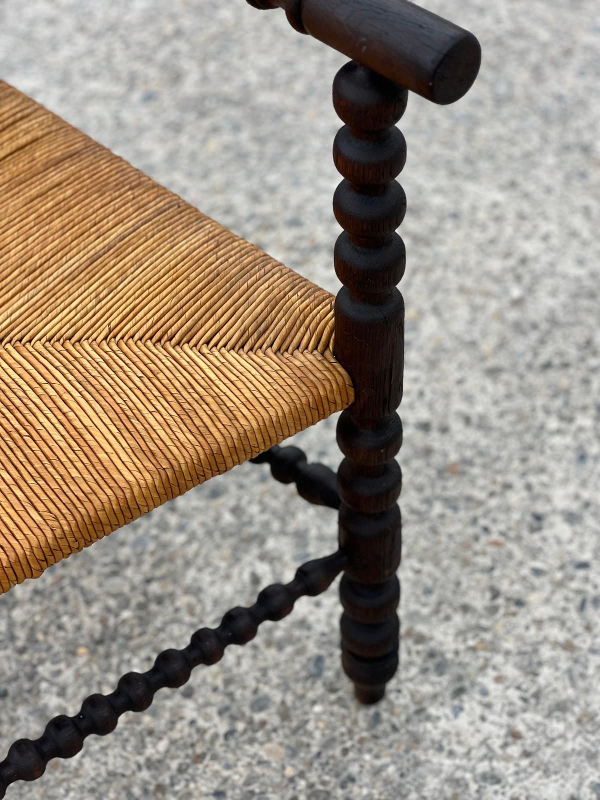 Fauteuil dit Bobbin en chêne teinté, 1930