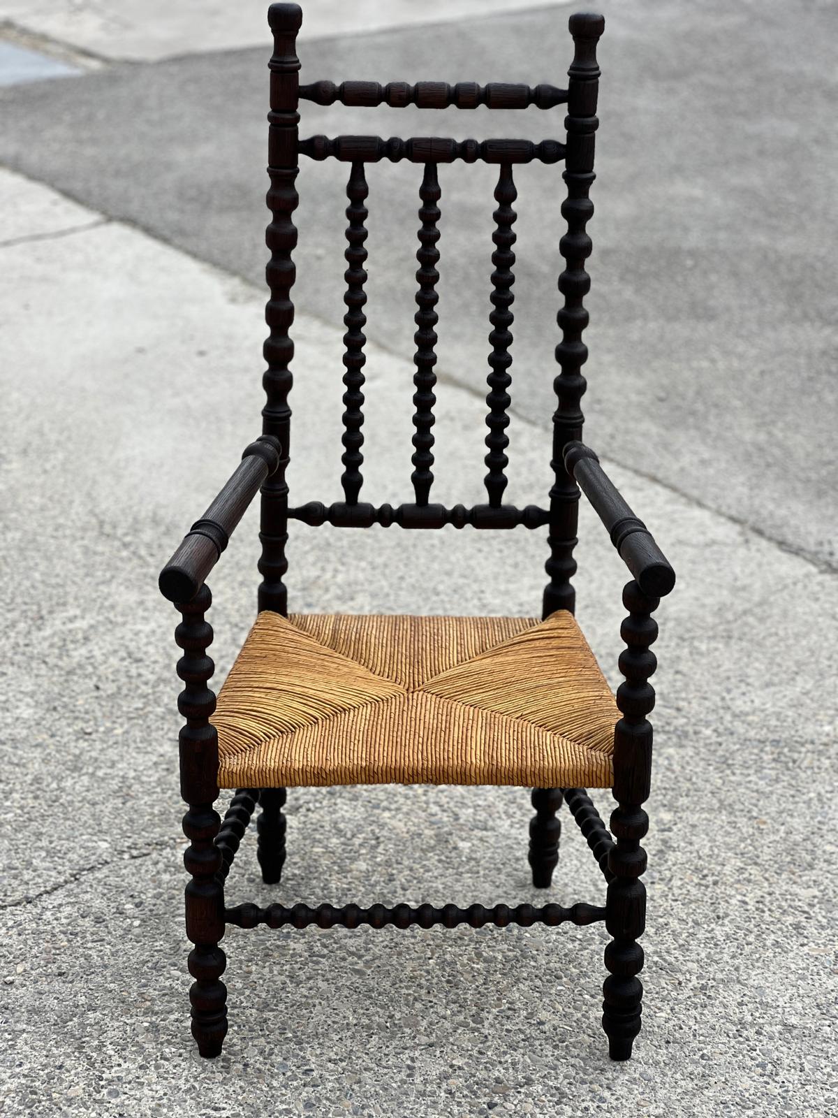 Fauteuil dit Bobbin en chêne teinté, 1930
