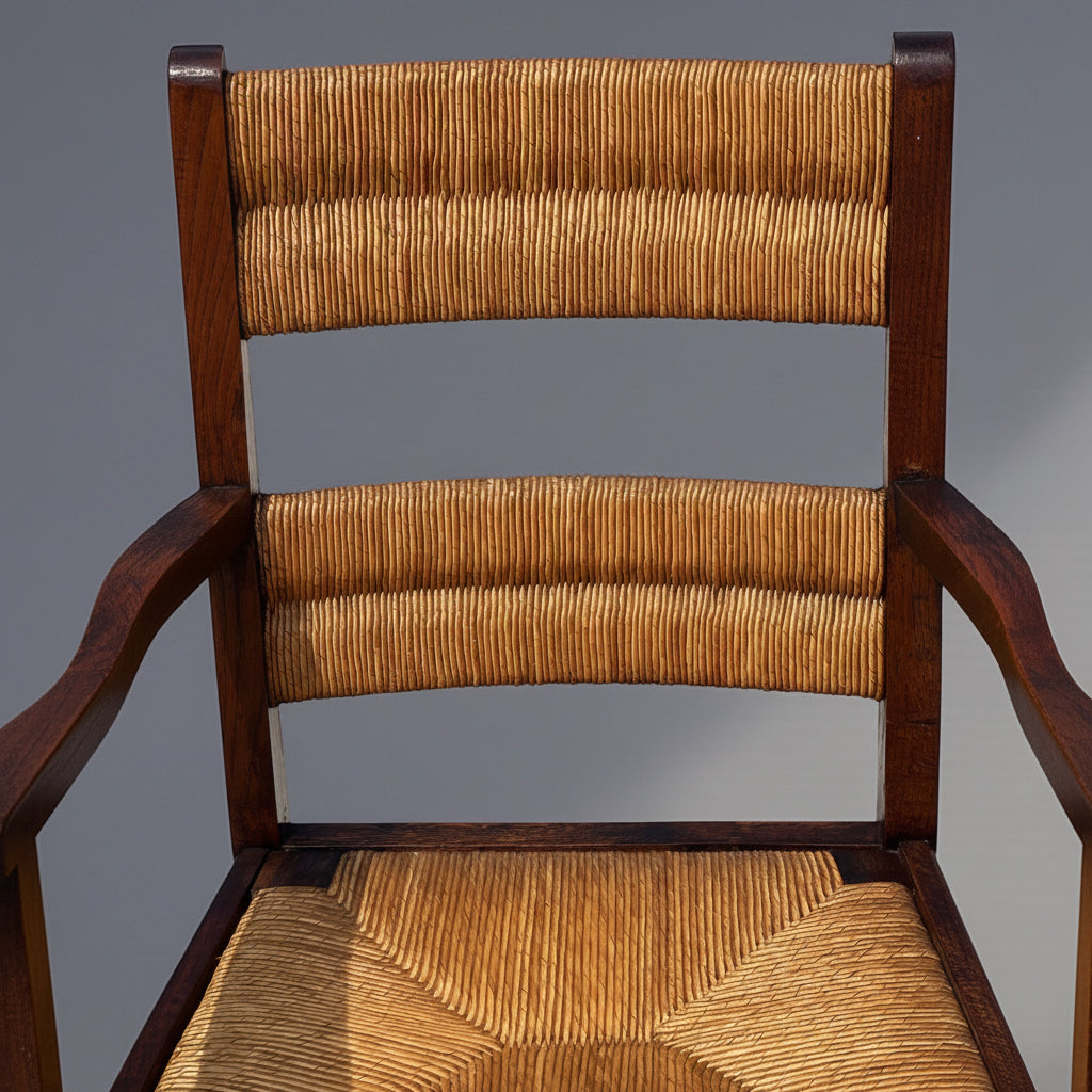 Paire de fauteuils chêne teinté et paille, travail français 1950